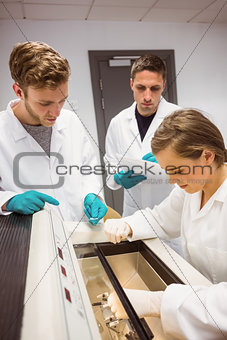 Science students using incubator in the lab
