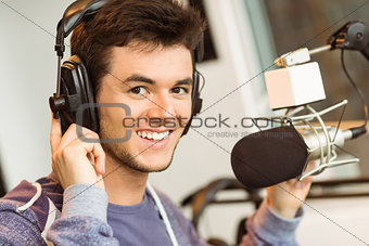 Portrait of an university student recording audio