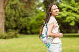 Portrait of a smiling student with a shoulder bag