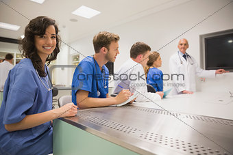 Medical student smiling at the camera during class