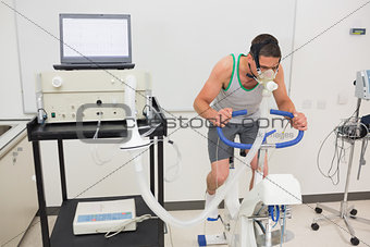 Man doing fitness test on exercise bike