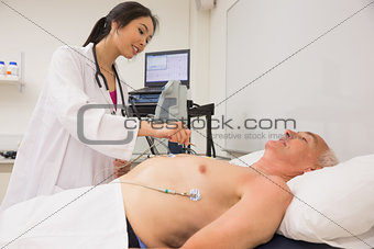 Medical student practicing on older man
