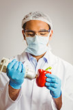 Food scientist using device on pepper
