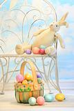 Easter bunny with eggs on chair