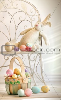 Stuffed rabbit on iron chair 