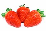 Three strawberries closeup isolated on white