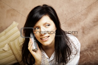 young woman is speaking on cell phone