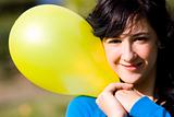 Cute girl with yellow colored balloon