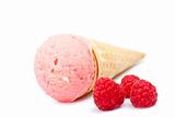 Strawberry ice cream cone with raspberries
