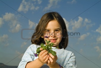 girl holding plant