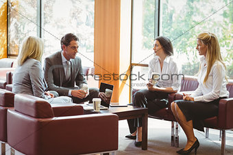 Business people talking and working together on sofa