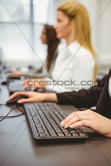 Close up of a businesswoman typing on keyboard