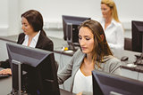 Focused businesswomen working in computer room