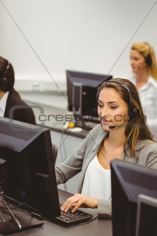 Call centre agents talking on the headset