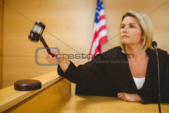 Judge about to bang gavel on sounding block