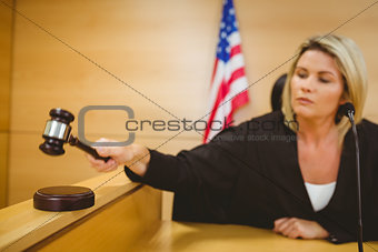 Judge about to bang gavel on sounding block
