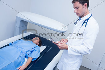 Focused doctor doing a radiography on a patient