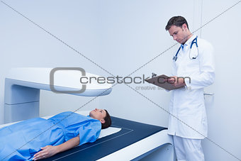 Focused doctor doing a radiography on a patient