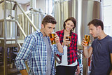 Young hipsters tasting beer together