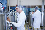 Scientists wearing lab coat and hair net