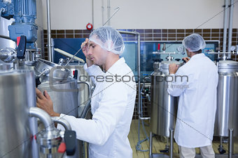 Scientists wearing lab coat and hair net