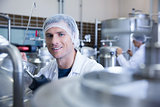 Close up of a man wearing a hair net looking at the camera