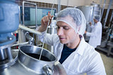 Scientist using brewer in the container
