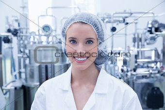 Portrait of a smiling scientist wearing hair net
