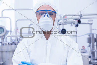 Portrait of a scientist standing with arms crossed