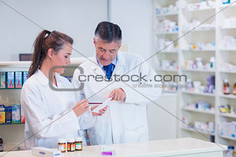 Pharmacist and his trainee working together