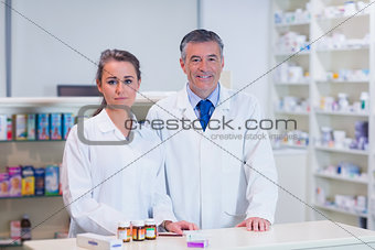 Pharmacist and his trainee looking at the camera