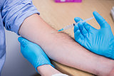 Close up of a patient receiving injection