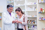 Pharmacist and customer talking about medication