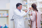 Pharmacist explaining medicine to patient