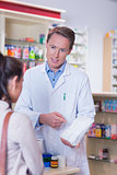 Pharmacist and sick customer speaking