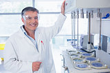 Smiling scientist with safety glasses