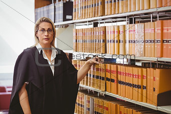 Portrait of a serious lawyer with reading glasses