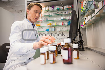 Pharmacist using computer at desk