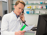 Serious pharmacist on the phone