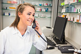 Young pharmacist on the phone