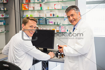 Team of pharmacists using the computer