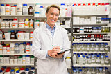 Handsome pharmacist smiling at camera