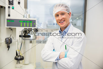 Pharmacist using machinery to make medicine