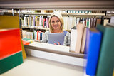 Mature student smiling in library