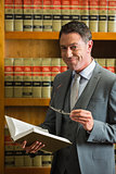 Lawyer reading book in the law library