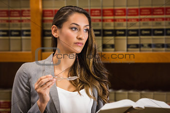 Pretty lawyer reading in the law library