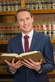Lawyer reading in the law library