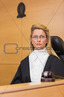 Stern judge looking at camera