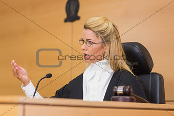 Stern judge speaking to the court