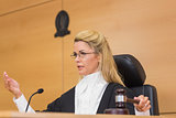 Stern judge speaking to the court